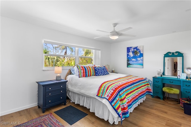 bedroom featuring hardwood / wood-style floors and ceiling fan