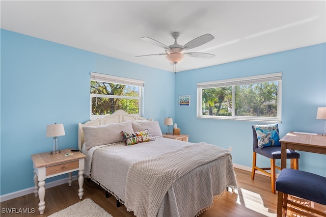 bedroom featuring hardwood / wood-style floors and ceiling fan