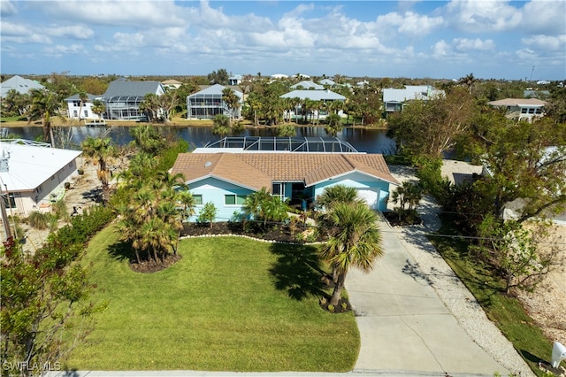 birds eye view of property with a water view