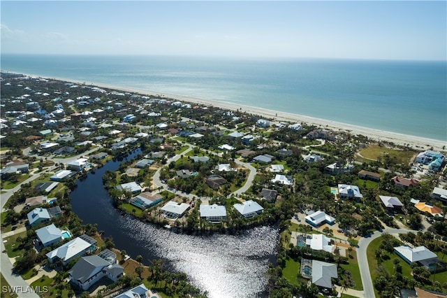 drone / aerial view with a view of the beach and a water view