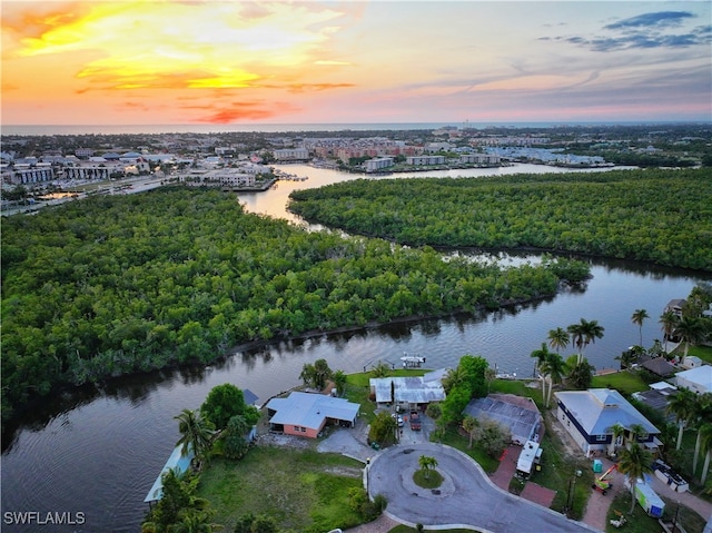 aerial view at dusk with a water view