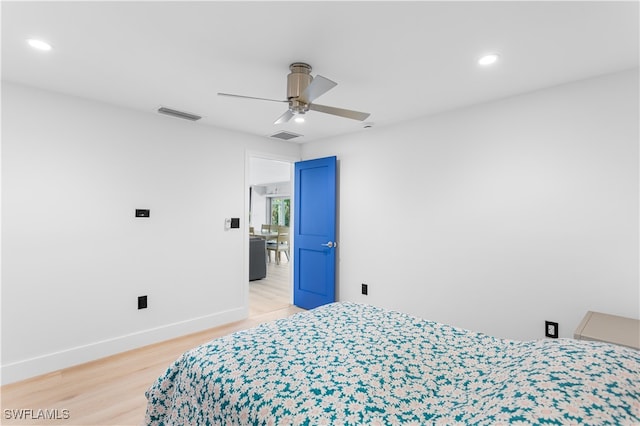 bedroom with ceiling fan and wood-type flooring