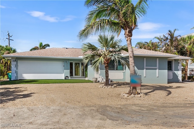 single story home with a garage