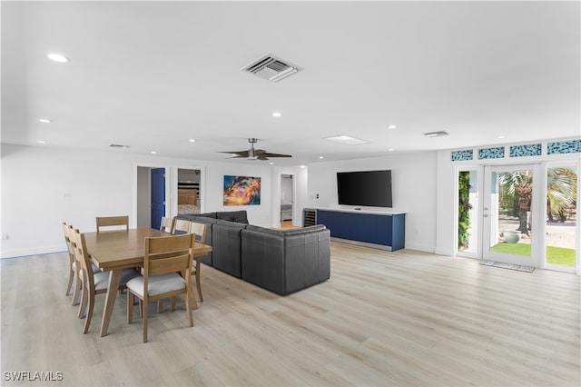 dining area featuring ceiling fan and light hardwood / wood-style flooring