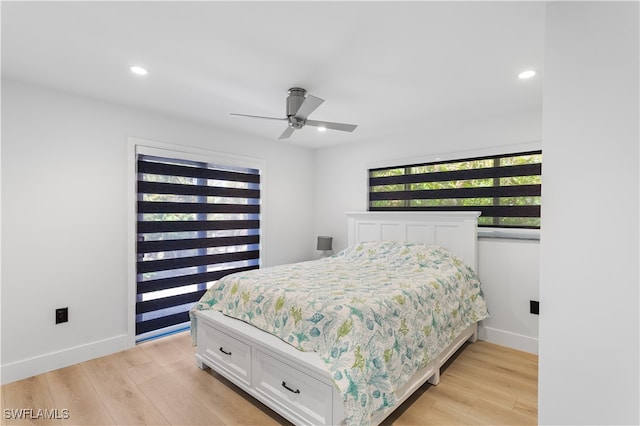 bedroom featuring light wood-type flooring and ceiling fan