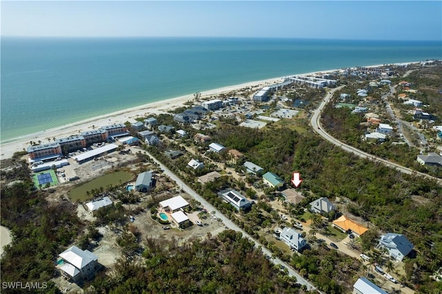 aerial view with a water view and a view of the beach