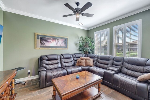 living room featuring ceiling fan, wood-type flooring, and ornamental molding