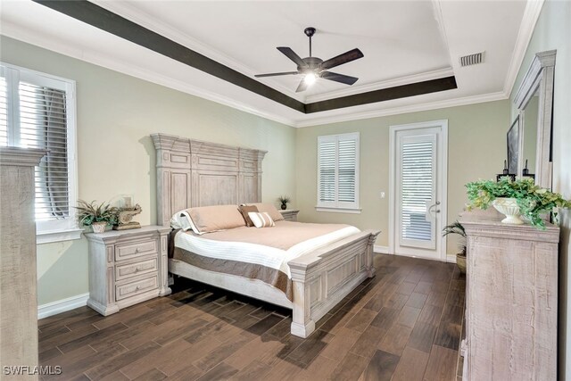 bedroom featuring dark hardwood / wood-style flooring, access to exterior, ceiling fan, a raised ceiling, and crown molding