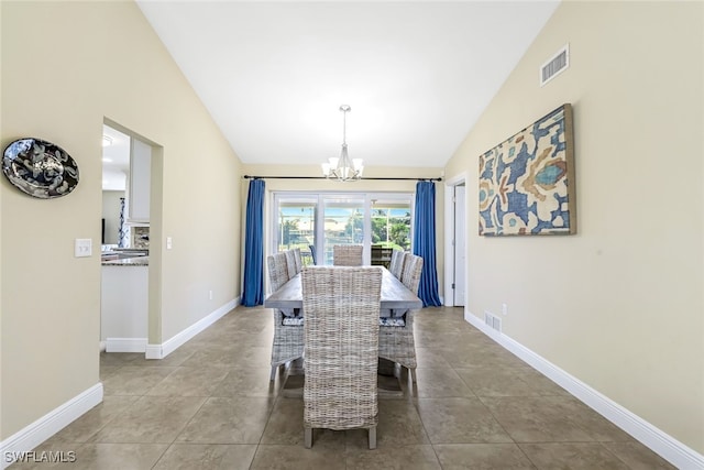 dining space featuring tile patterned flooring, vaulted ceiling, and a notable chandelier