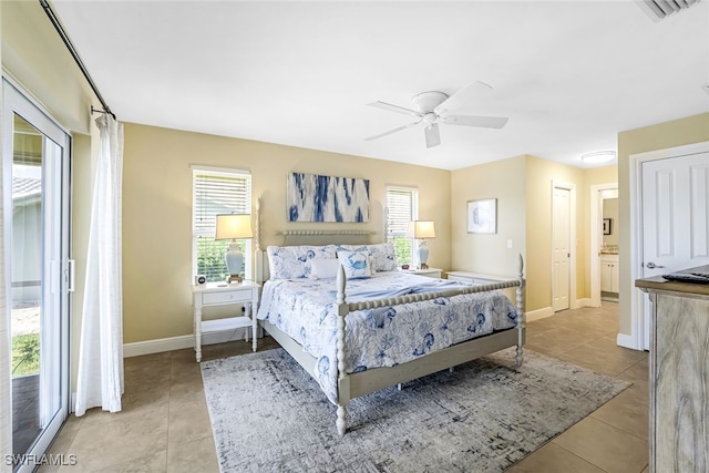 tiled bedroom with multiple windows, ceiling fan, and access to exterior