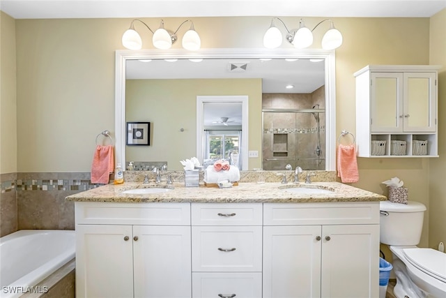 full bathroom with vanity, toilet, and separate shower and tub