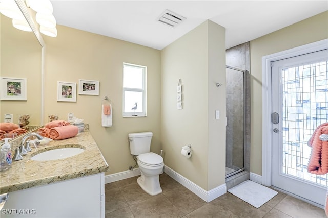 bathroom with toilet, an enclosed shower, vanity, and tile patterned floors