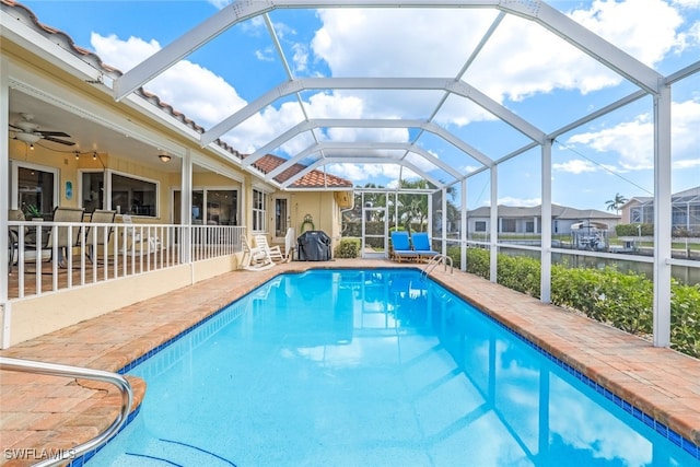 view of pool featuring a patio, a lanai, and ceiling fan