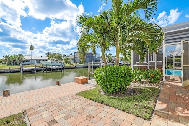 dock area featuring glass enclosure and a water view