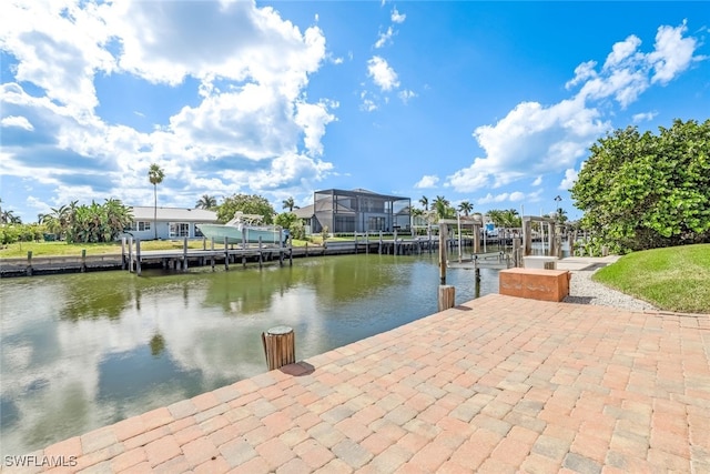 view of dock with a water view and a lanai