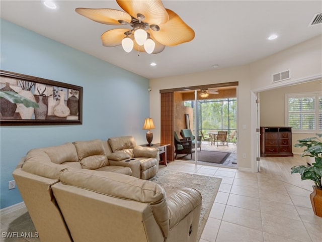 living room with light tile patterned flooring and ceiling fan