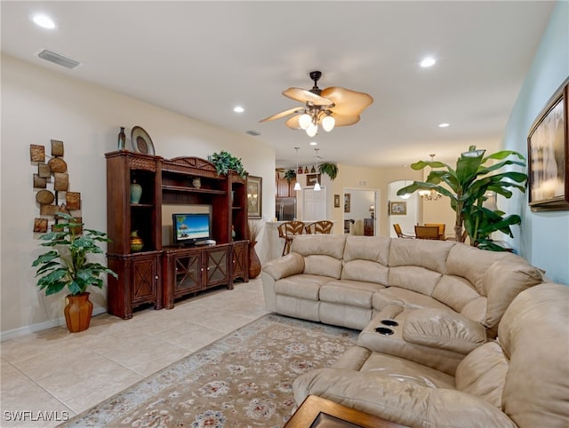 tiled living room featuring ceiling fan