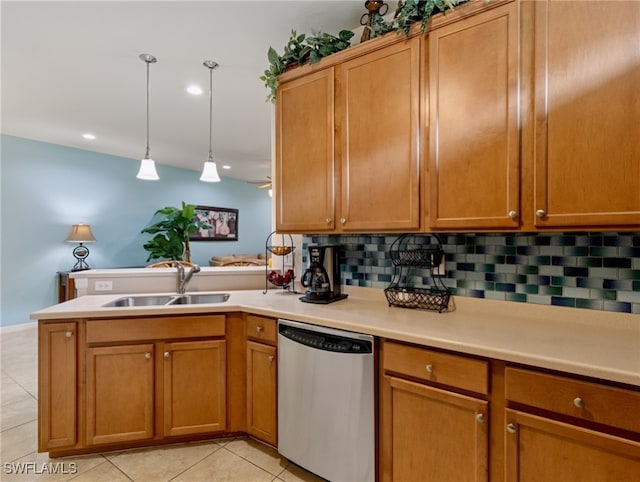 kitchen featuring stainless steel dishwasher, kitchen peninsula, pendant lighting, and tasteful backsplash