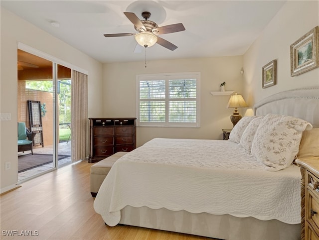 bedroom with access to exterior, multiple windows, light hardwood / wood-style floors, and ceiling fan