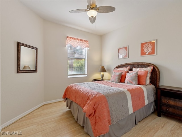 bedroom featuring light hardwood / wood-style floors and ceiling fan