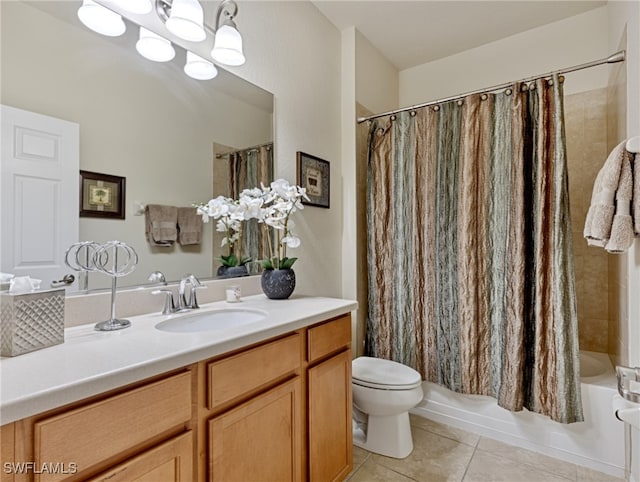 full bathroom featuring vanity, toilet, tile patterned floors, and shower / tub combo