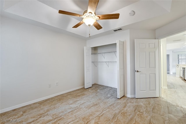 unfurnished bedroom featuring a closet and ceiling fan