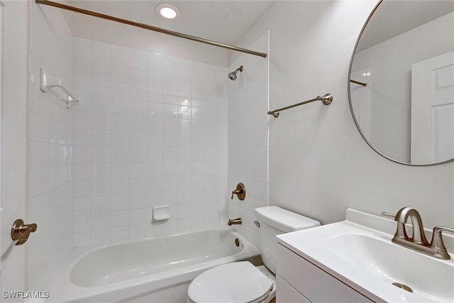 full bathroom with vanity, toilet, and tiled shower / bath