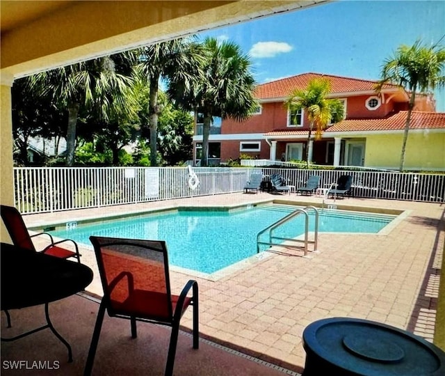 view of swimming pool with a patio area