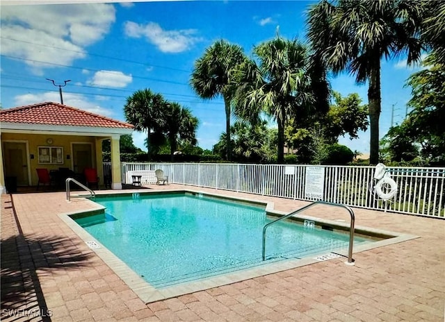 view of swimming pool with a patio area