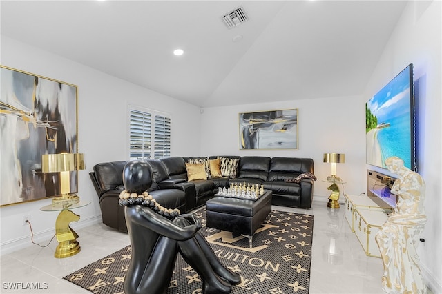 living room with light tile patterned floors and lofted ceiling