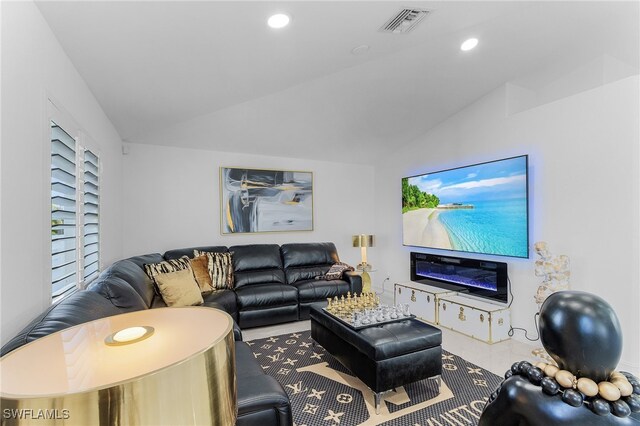 living room featuring vaulted ceiling