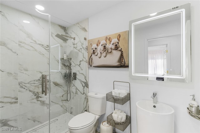 bathroom featuring toilet and an enclosed shower