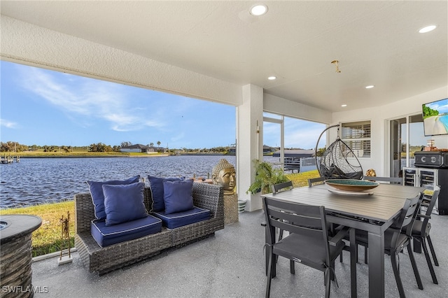 view of patio featuring a water view