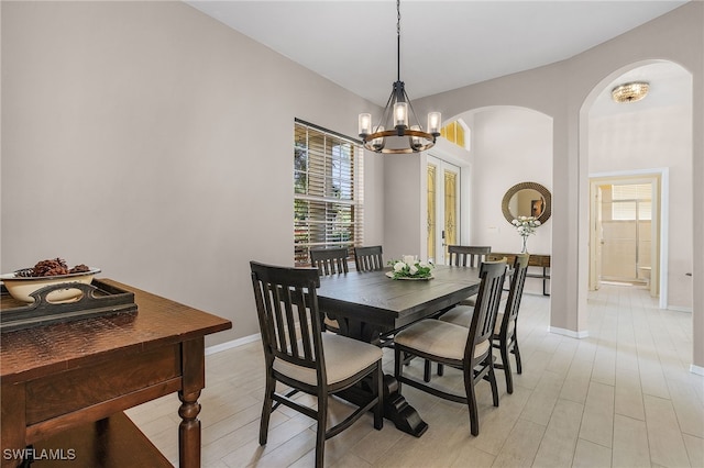 dining room featuring a chandelier and light wood-type flooring