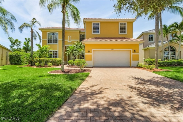 mediterranean / spanish-style home with a front lawn and a garage