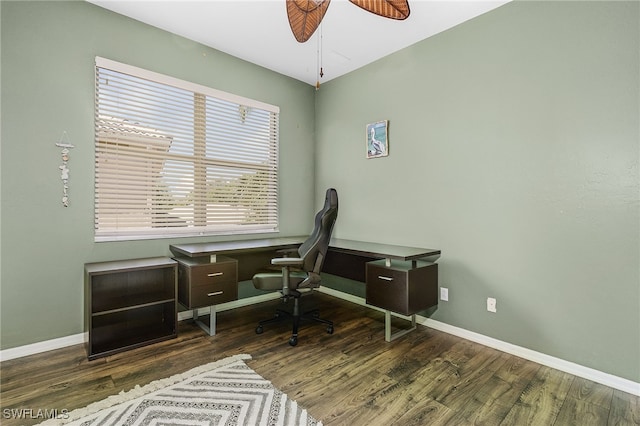 office with dark wood-type flooring and ceiling fan