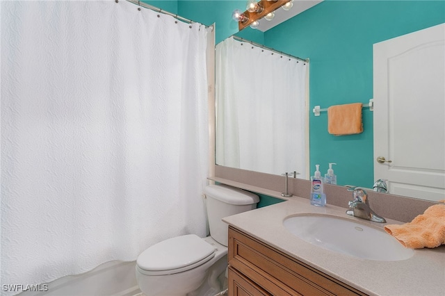 full bathroom with vanity, shower / tub combo with curtain, and toilet