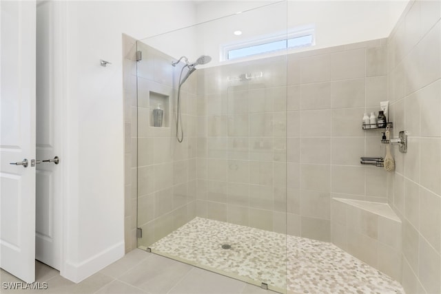 bathroom with tile patterned floors and an enclosed shower