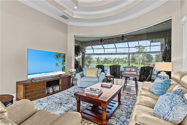 living room featuring wood-type flooring, plenty of natural light, ornamental molding, and ceiling fan