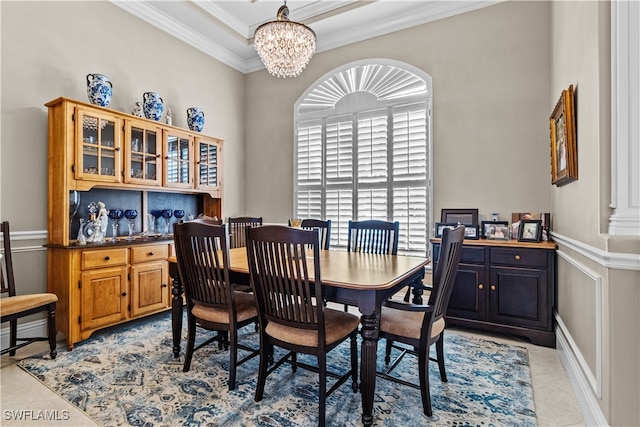 dining area with a chandelier, light tile patterned floors, and crown molding