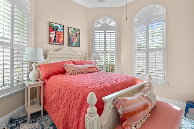 bedroom with crown molding