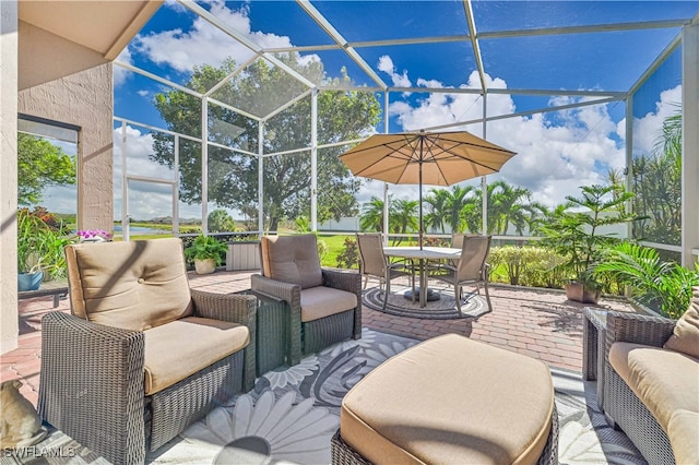 view of patio featuring a lanai