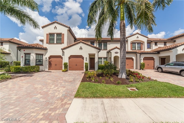 mediterranean / spanish-style home featuring a garage