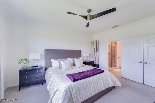 bedroom featuring ornamental molding, light carpet, ensuite bathroom, and ceiling fan