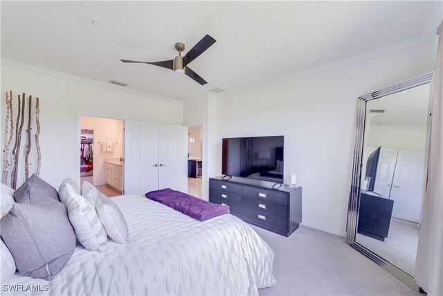 bedroom with light colored carpet, ceiling fan, crown molding, and ensuite bath