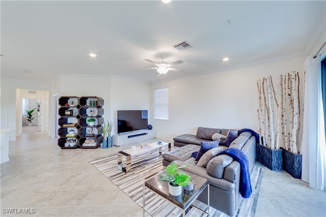 living room with crown molding, light tile patterned floors, and ceiling fan