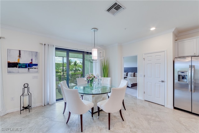 dining area featuring crown molding