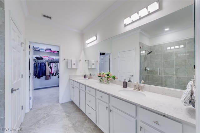 bathroom featuring vanity, crown molding, and a shower with shower door