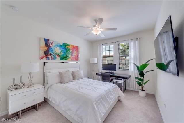 bedroom with light colored carpet and ceiling fan