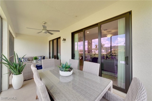 exterior space with ceiling fan and an outdoor hangout area